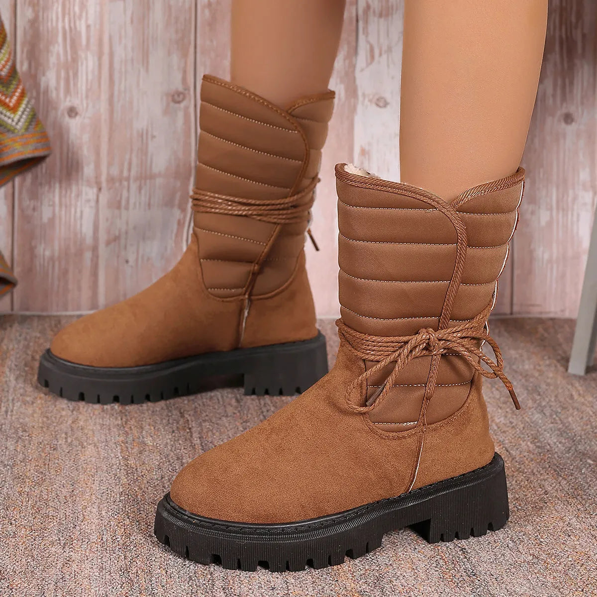 Women's chunky heel mid-tube snow boots in black with lace-up design and rubber sole