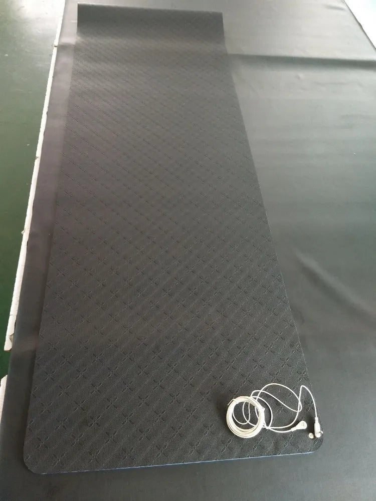 Blue conductive yoga mat with botanical pattern and integrated grounding wire