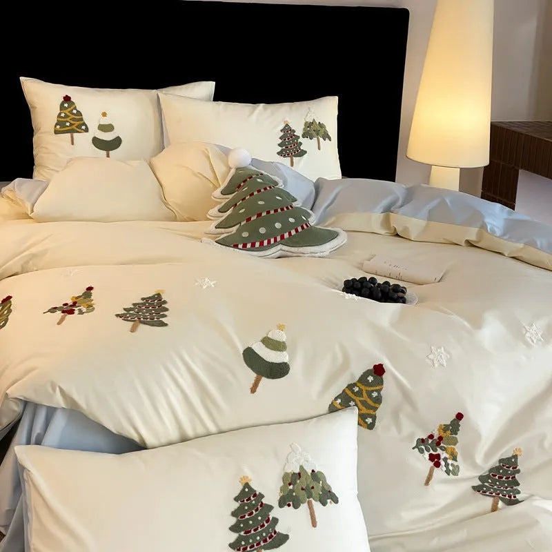 Pure cotton bedding set with embroidered Christmas trees on duvet cover, sheet, and pillowcases in cream blue or green.