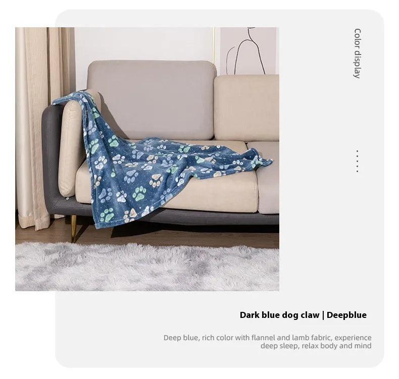 Blue dog cartoon print pet blanket laid flat, showing double-sided flannel texture.