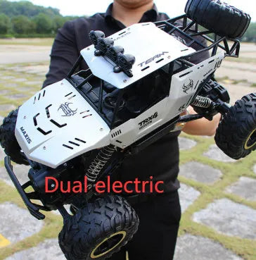 Black and silver 4WD remote control off-road climbing cars on rough terrain showing two size options.