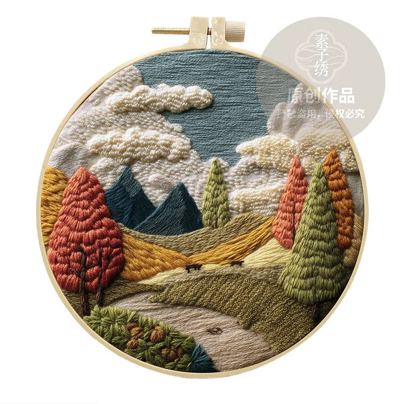 Embroidery DIY kit with landscape-printed cotton fabric, thread, needles, and a 15cm bamboo-style frame.