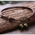 Nylon rope dog collar with brass bell shown in black, red, and coffee colour options on a plain background.