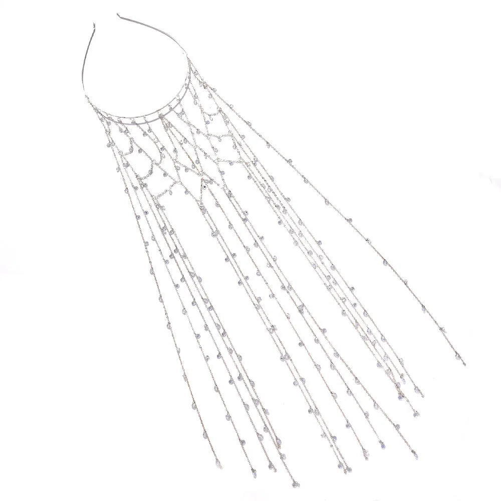 Gold coloured rhinestone hair band with a draped mesh tassel decoration.