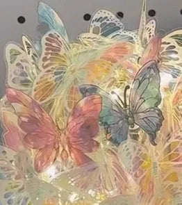 Butterfly night light with glass lampshade on raw wood base for bedroom ambience lighting