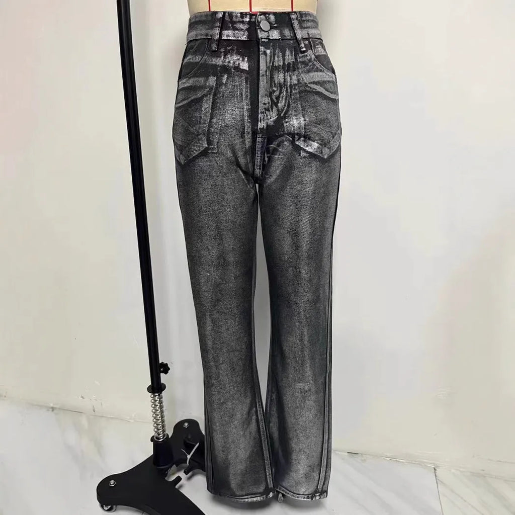 Women's washed blue high-waist straight-leg jeans with silver contrast hardware on a denim background.