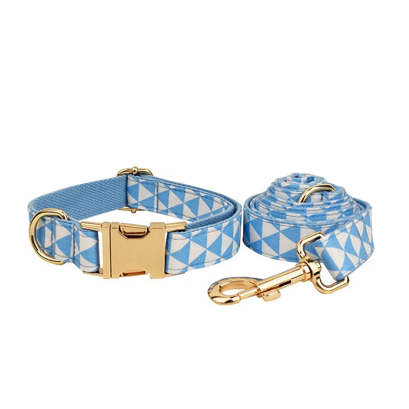 Blue four-piece dog clothing set showing vest, collar, lead and bow accessory in adjustable sizes from XS to XL