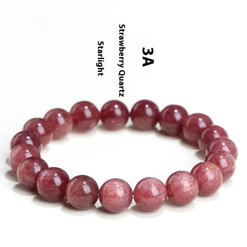 Natural cherry red strawberry quartz bracelet with geometry-shaped beads on a wrist.