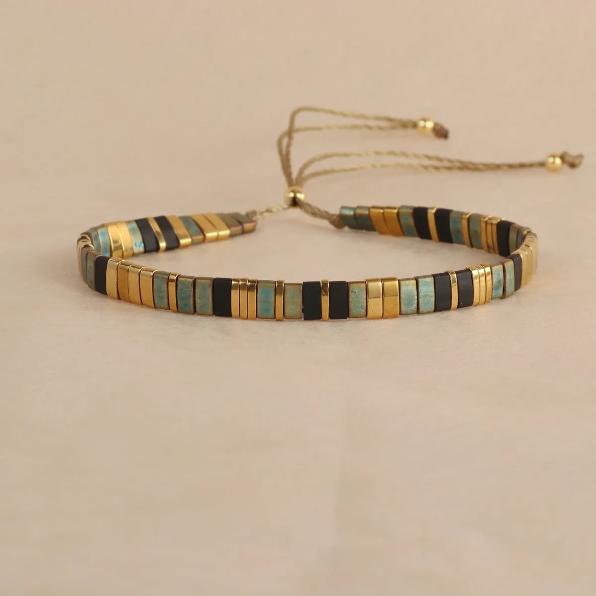Geometric glass bead bracelet with pull bead closure in five colour options