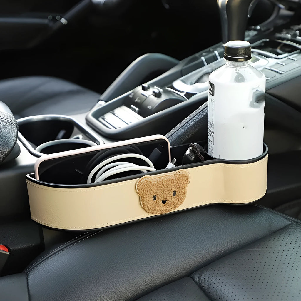 Leather car seat gap storage box with cartoon bear design hanging between vehicle seats