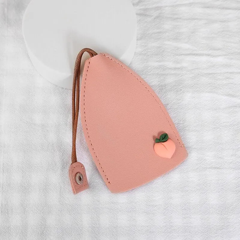 Cartoon pull-out key case in PU leather measuring 14 by 7.5 centimetres