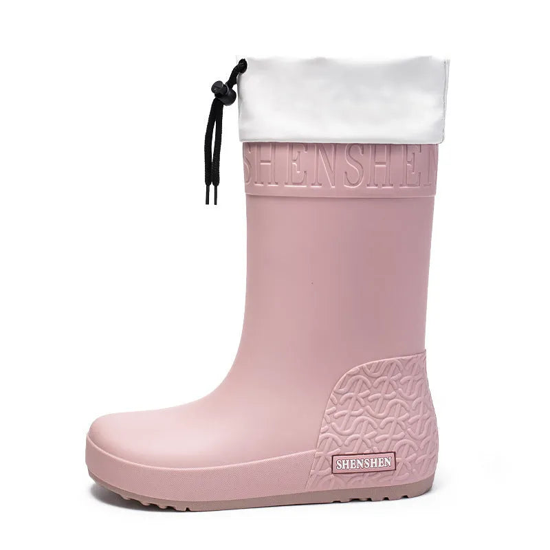 Women's solid colour PVC rain boots in apricot, shown with a non-slip sole.