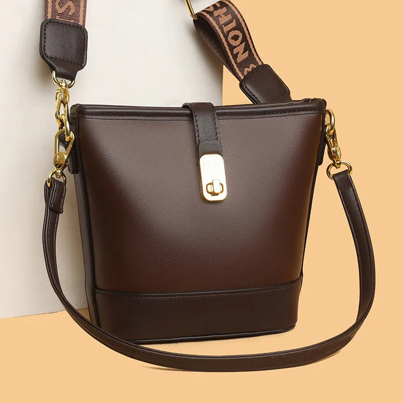 Korean style soft PU bucket messenger bag with double shoulder straps in black colour showing sandwich pocket and sewing thread details