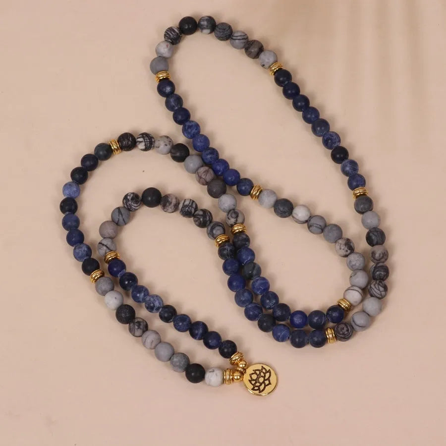 Blue multi-layer alloy bracelet with patterned network stone beads.