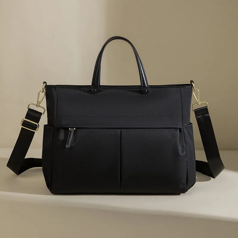 Women's Oxford cloth laptop bag in elegant black or nuts and apricots colours with contrast stitching