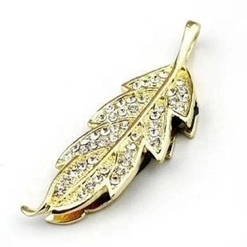 Silver metal USB flash drive with a crystal maple leaf decoration on a white background.