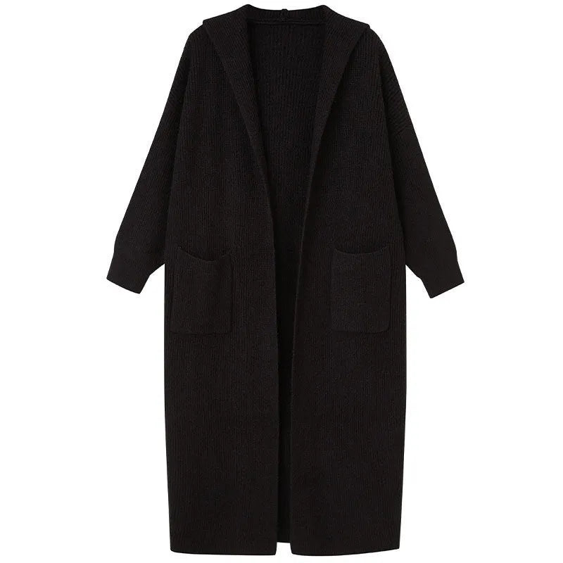 Long grey knitted hooded cardigan trench coat with loose fit on a model.