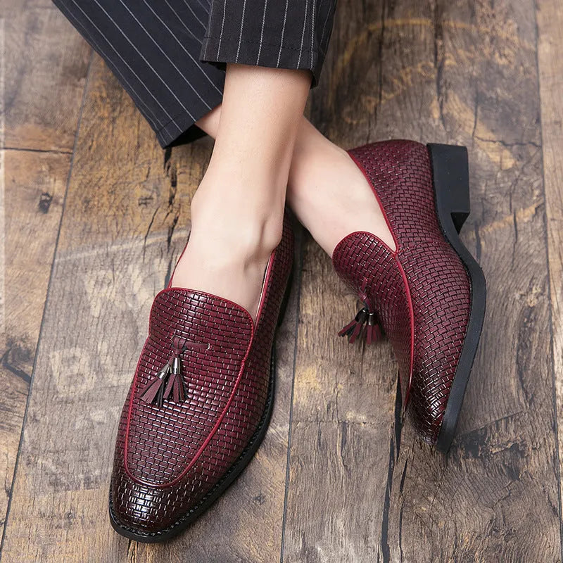 Men's black pointed slip-on business shoes with tassel detail on artificial PU upper