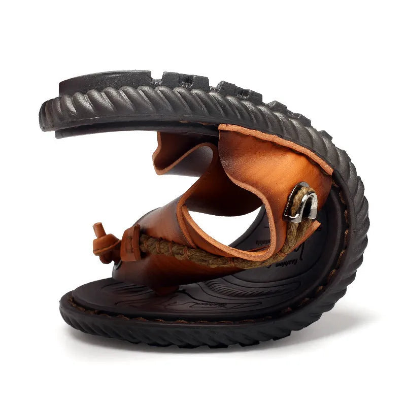 Men's dark blue herringbone patterned outdoor slippers with leather lining and rubber sole, shown in a large size.