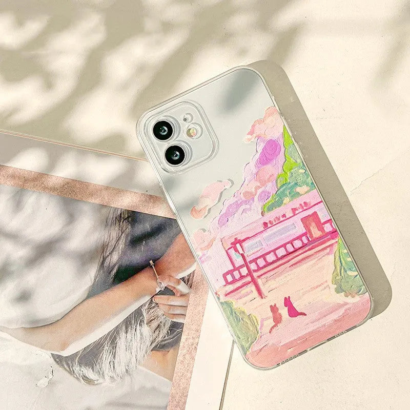 Soft silicone iPhone case with a colourful cartoon print of two cats on the back.