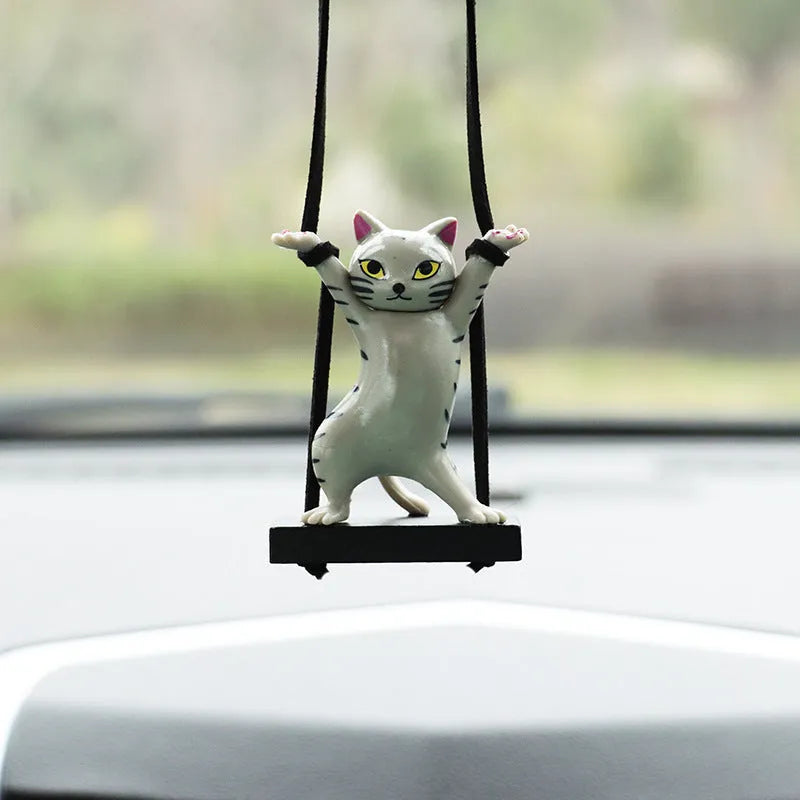 Cartoon-style resin cat pendant on an adjustable rope for car interior decoration.