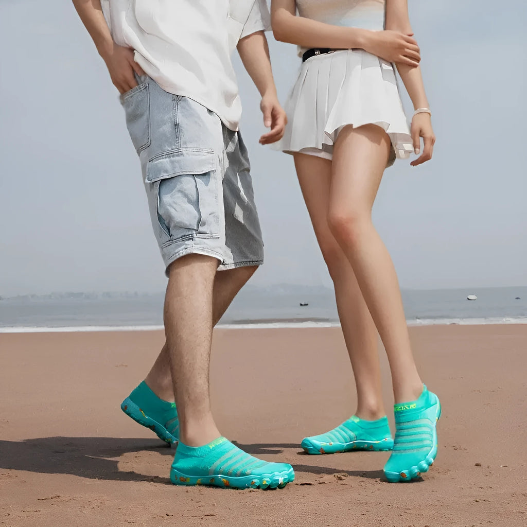Flyknit water shoes in camouflage colour with flat rubber sole and lace-up front.