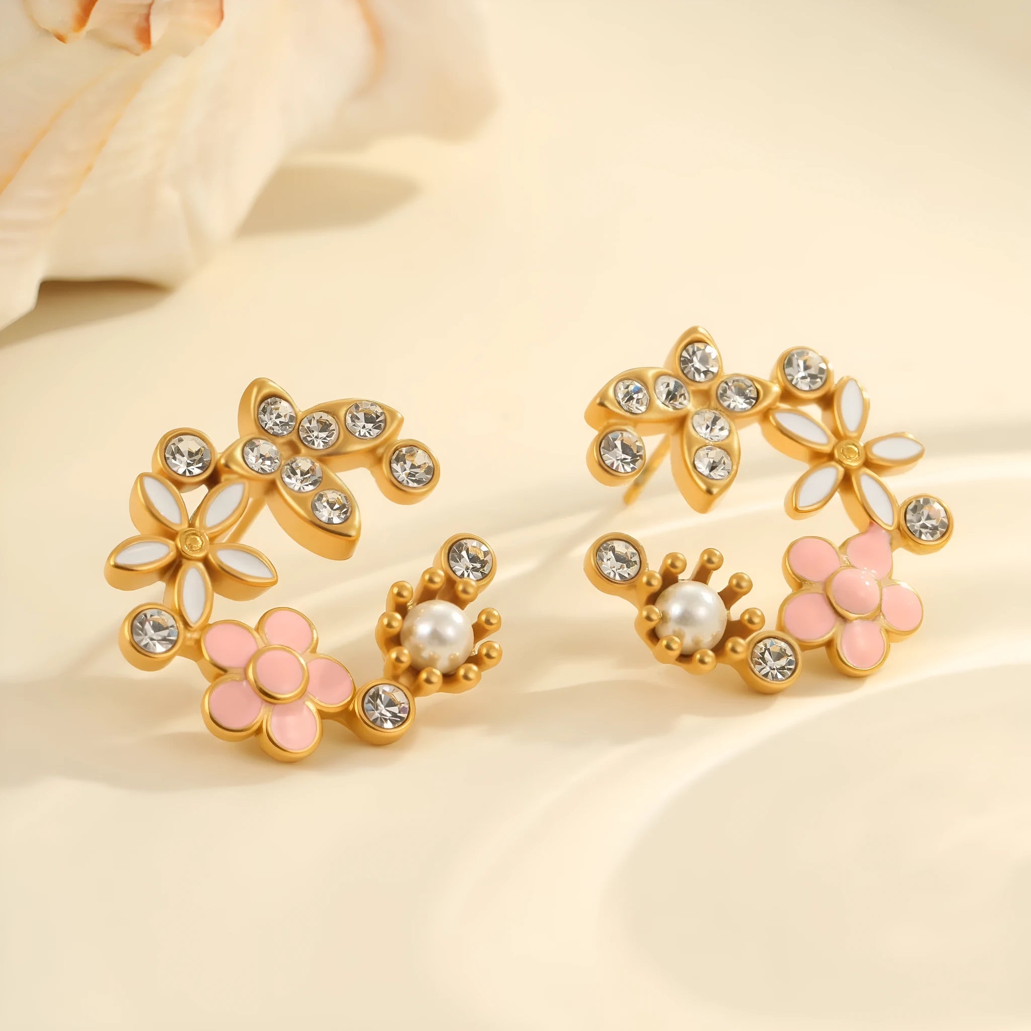 A pair of flower-shaped petal stud earrings with colourful oil finish and 18K electroplating on stainless steel.