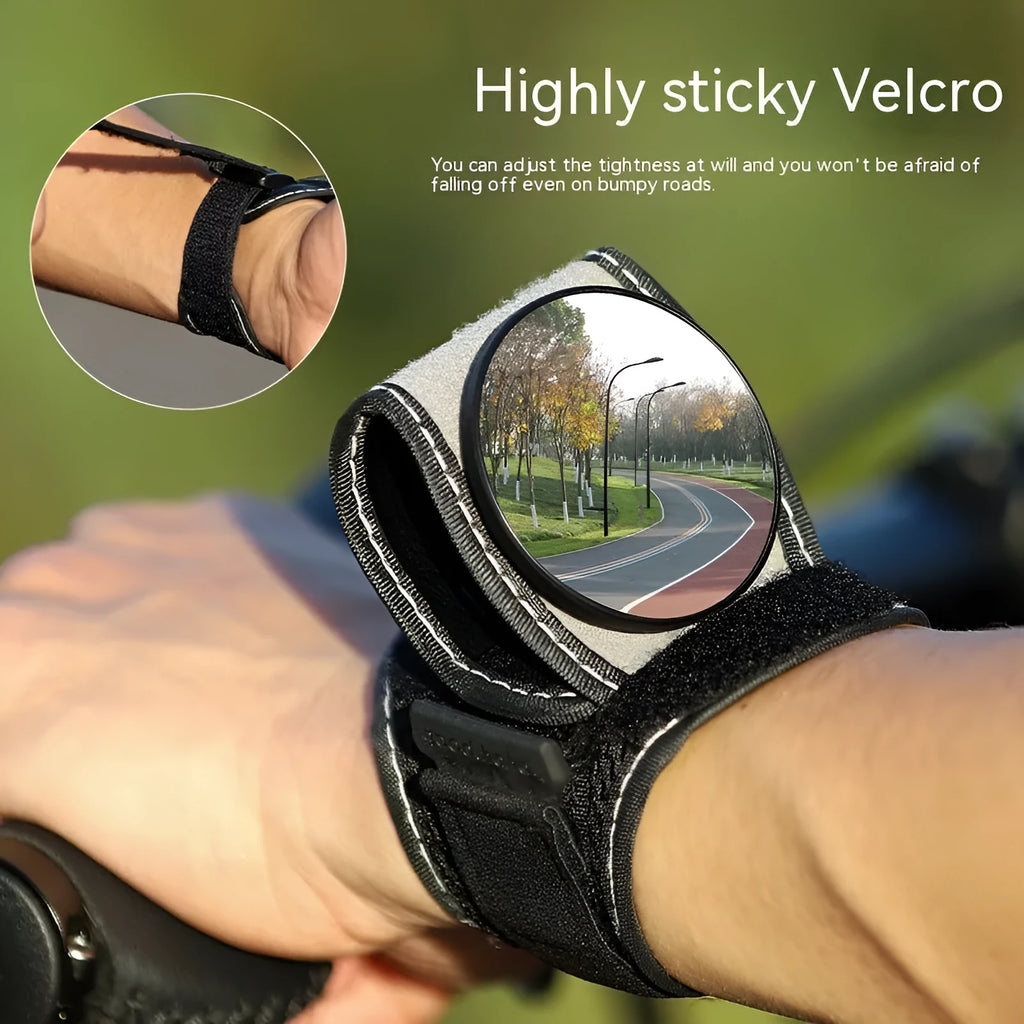 Black nylon wrist-mounted bicycle rear-view mirror with adjustable angle and secure strap for handlebar installation