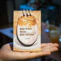 Mini coffee desk calendar 2025 with four design options on small desk surface