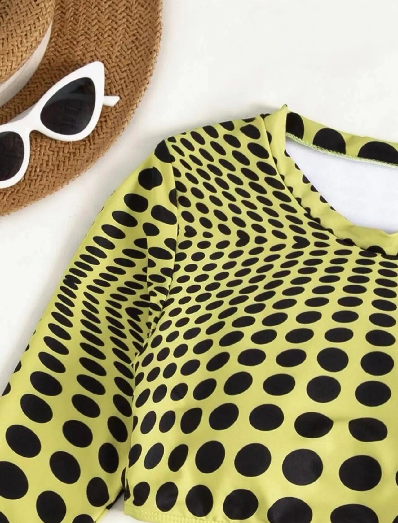 Women's green polka dot swimsuit three-piece set showing top, skirt, and bra components