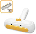 Yellow duck design portable pet hair remover brush with plastic handle and polyester bristles.