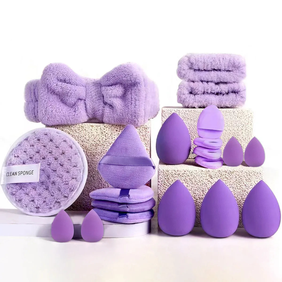 Beauty tool set with multiple pieces in brown, pink and purple colours for face wash and makeup application