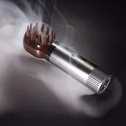 USB rechargeable Middle Eastern comb aromatherapy stove in silver, 14x5x4cm, on a car dashboard