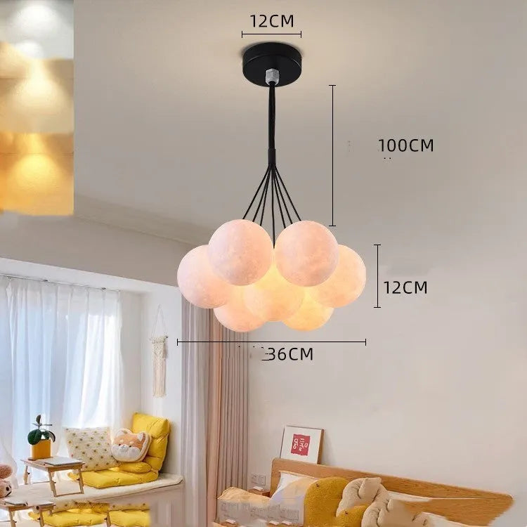 Nordic fish chandelier with moon bubble design in gold or black colours, showing iron body and PMMA lampshades