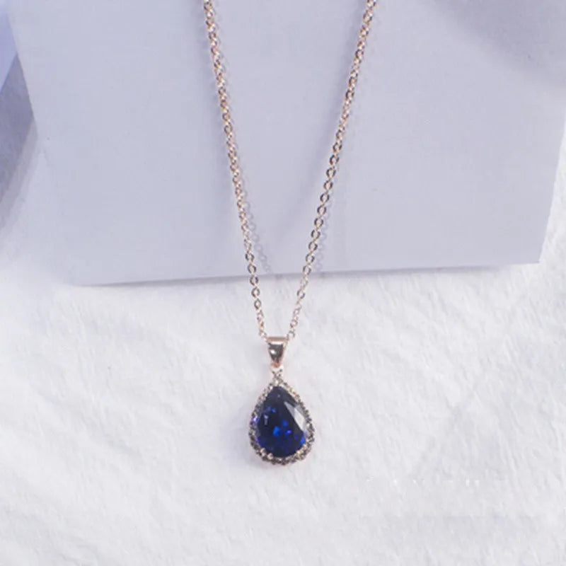 Pink rose gold drop shape rhinestone necklace with geometric design on alloy chain