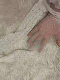Women's fishnet stockings with diamond mesh pattern in skin colour, black, or white.