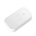 White multifunctional UV disinfection box with wireless charging pad for mobile phones and nail tools.