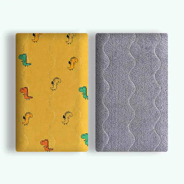 Double-sided cotton wool pet blanket with cartoon dinosaur print lying flat