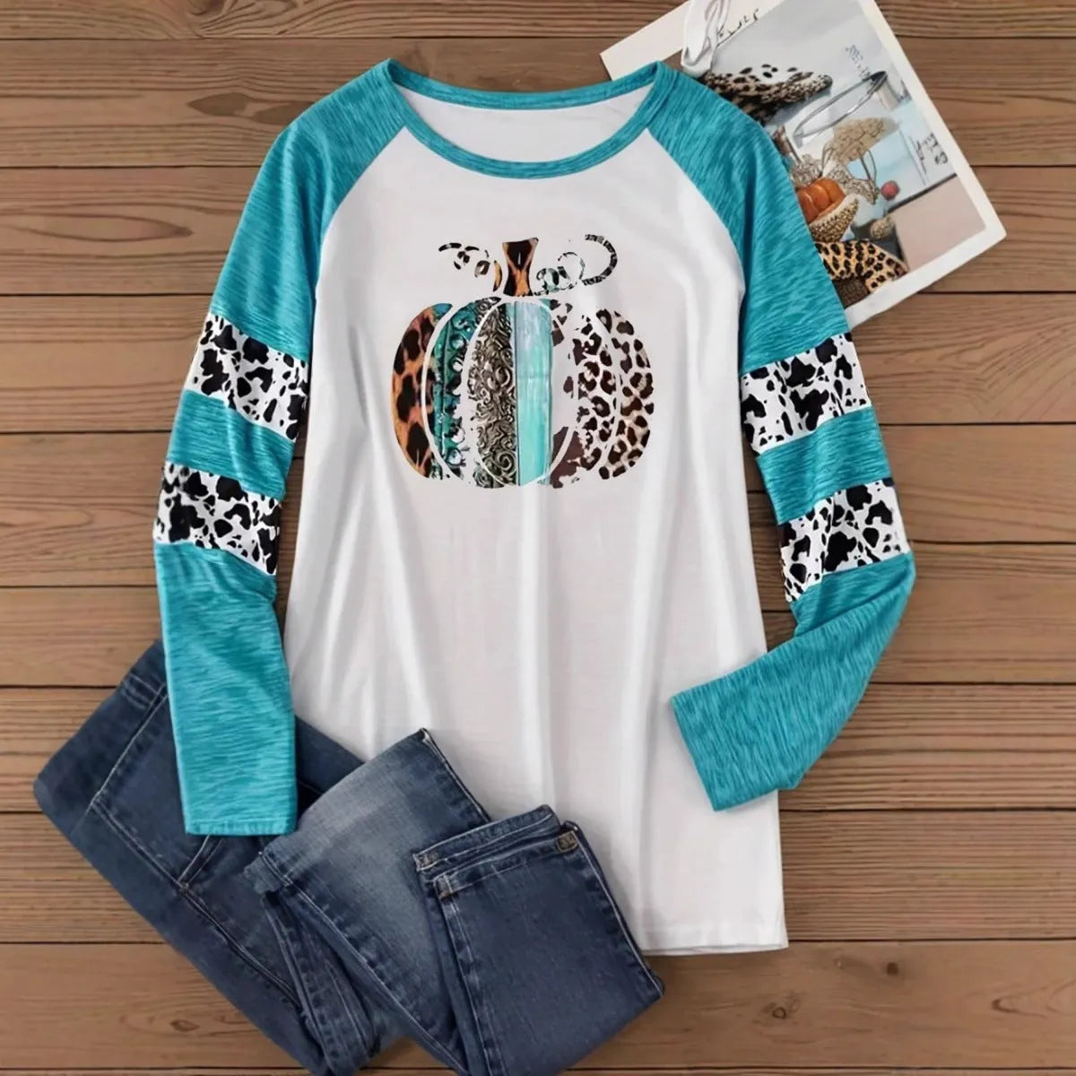 Sky blue long sleeve T-shirt with 3D digital print of a Halloween pumpkin.