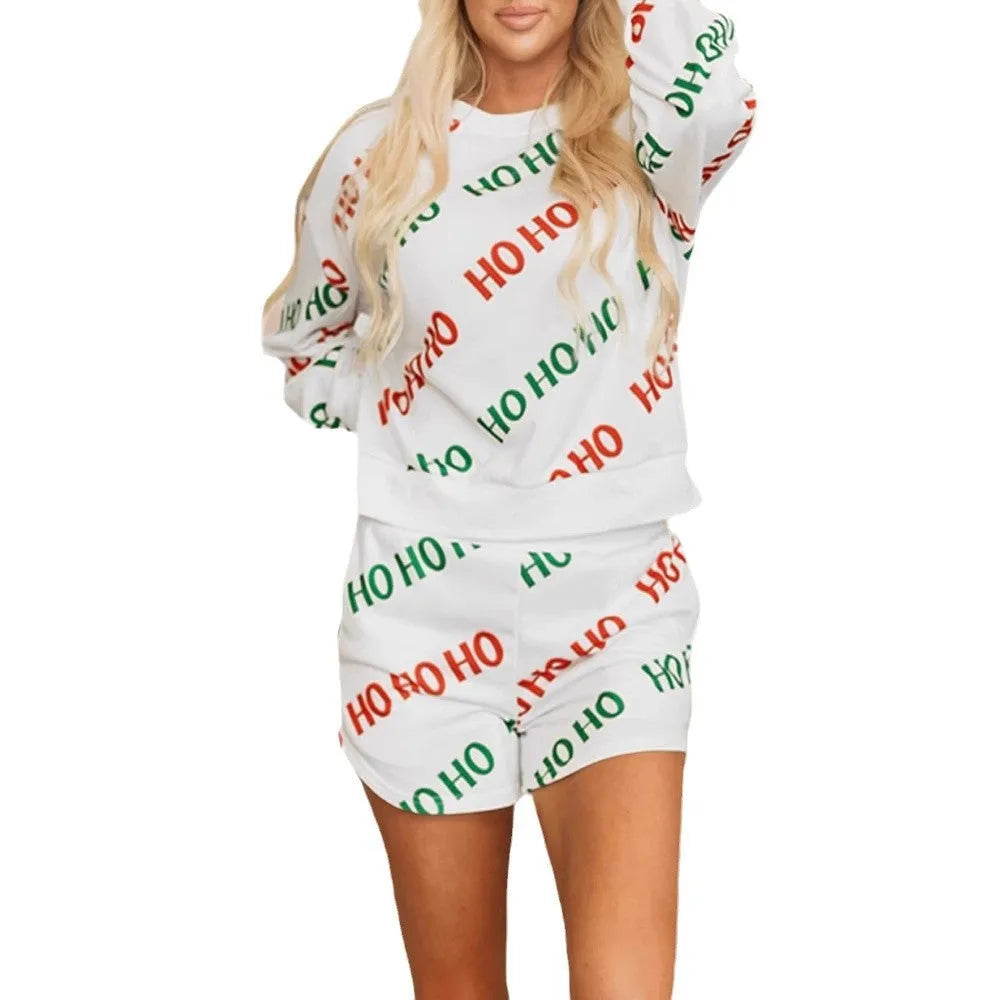 White women's two-piece suit with letters printed design showing long-sleeved top and fifth-length trousers