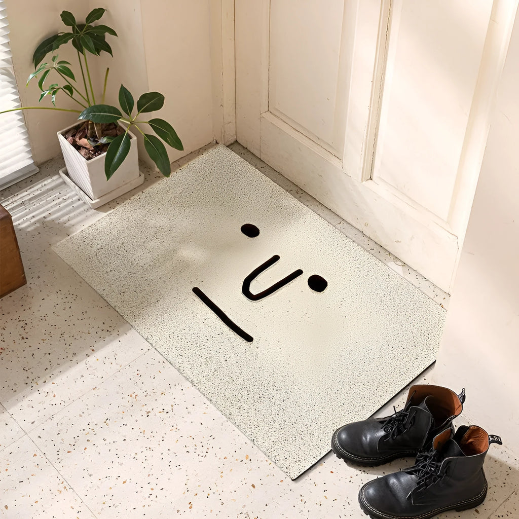 Square PVC floor mat with a large cartoon face Mr Big Nose design and geometric pattern on a grey background.