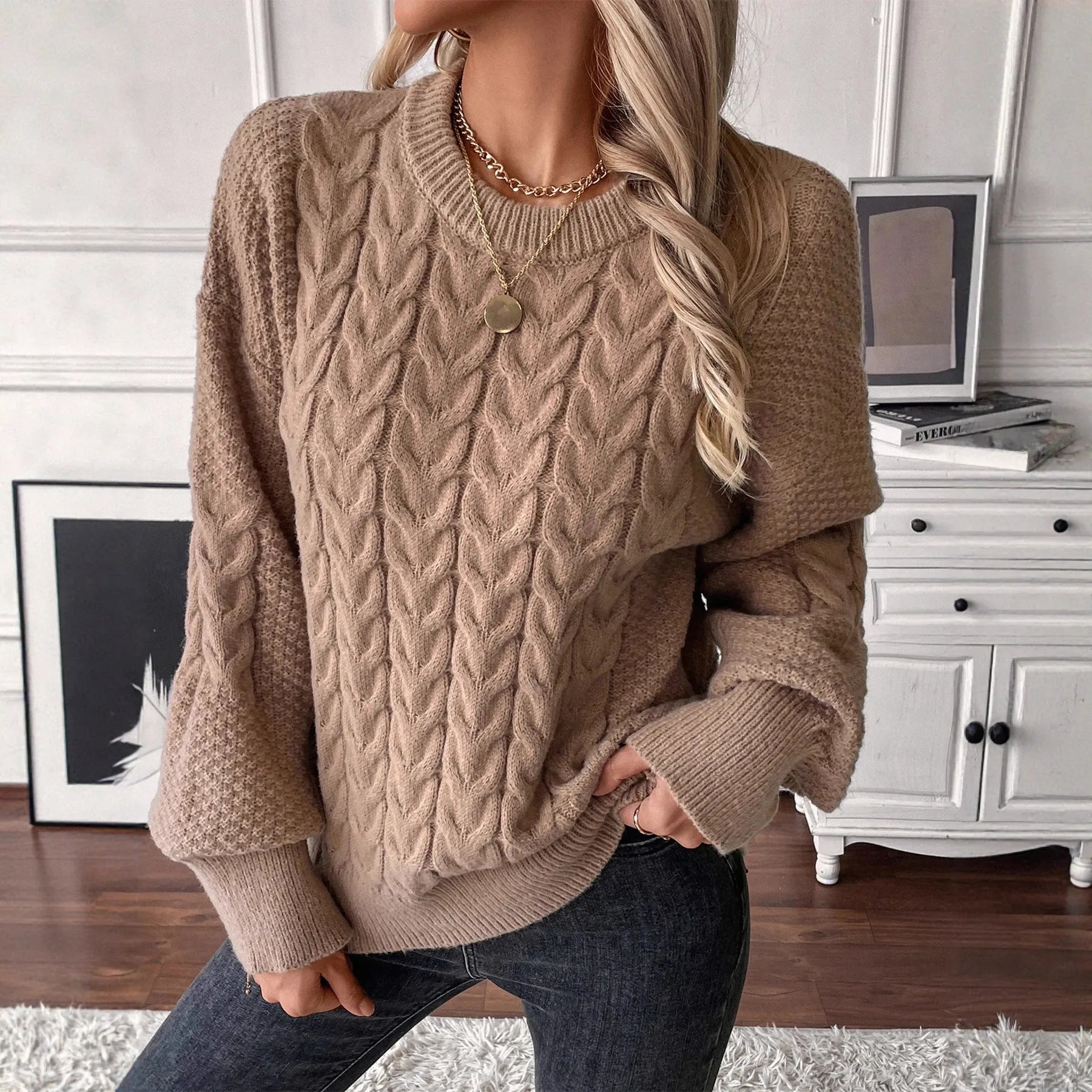Women's beige loose pullover sweater with round neck and regular sleeves on hanger