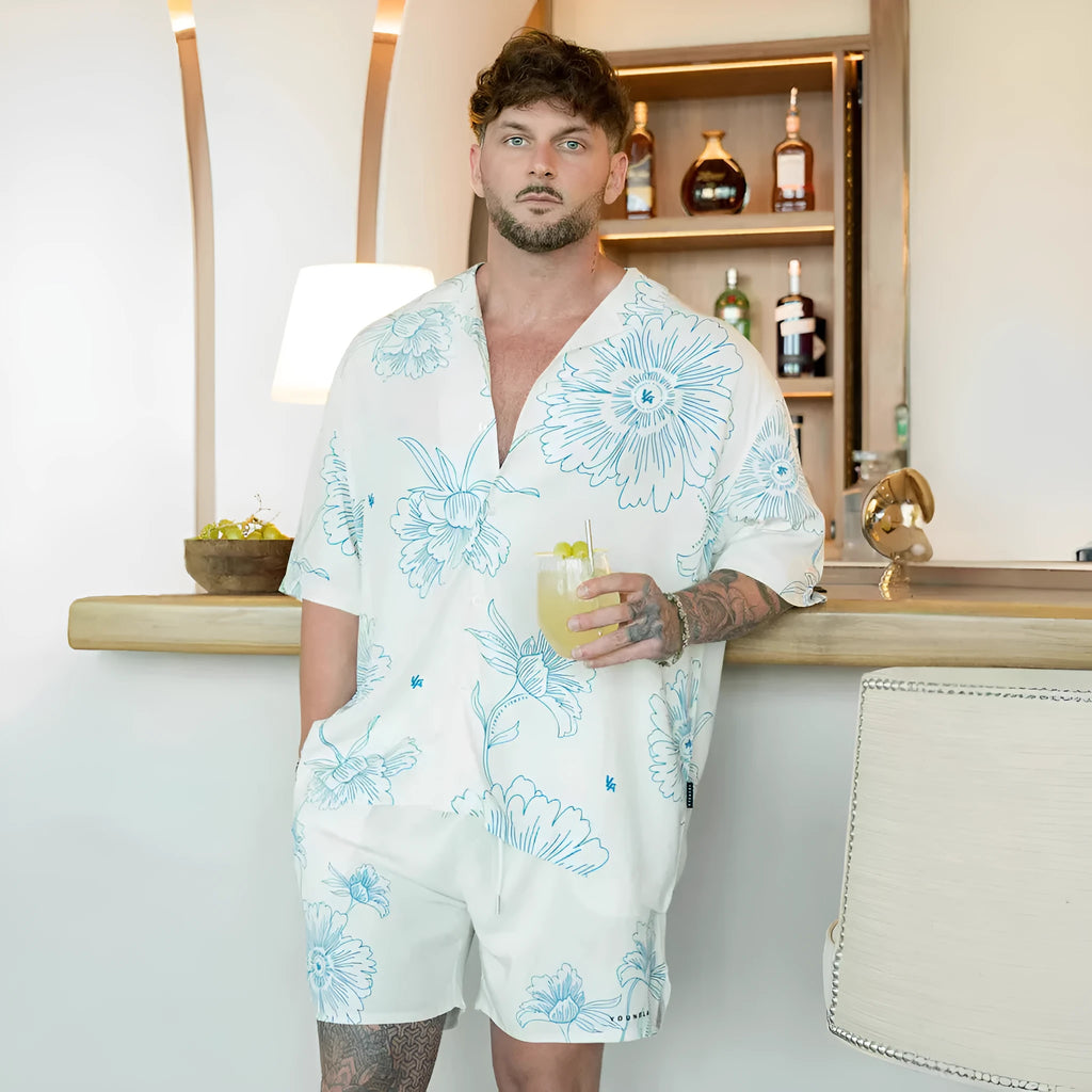 Men's loose floral print short-sleeve casual top in light colour on hanger