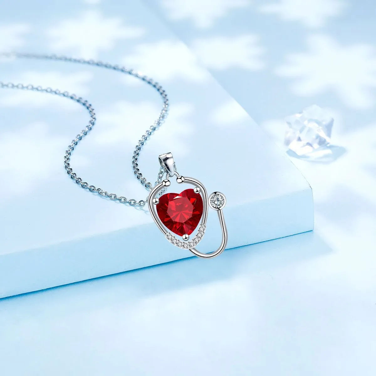 Women's copper necklace with a stethoscope pendant in a red diamond colour.
