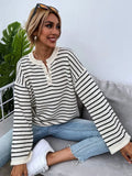 Black and white striped women's loose top with drop-shoulder sleeves and button detail
