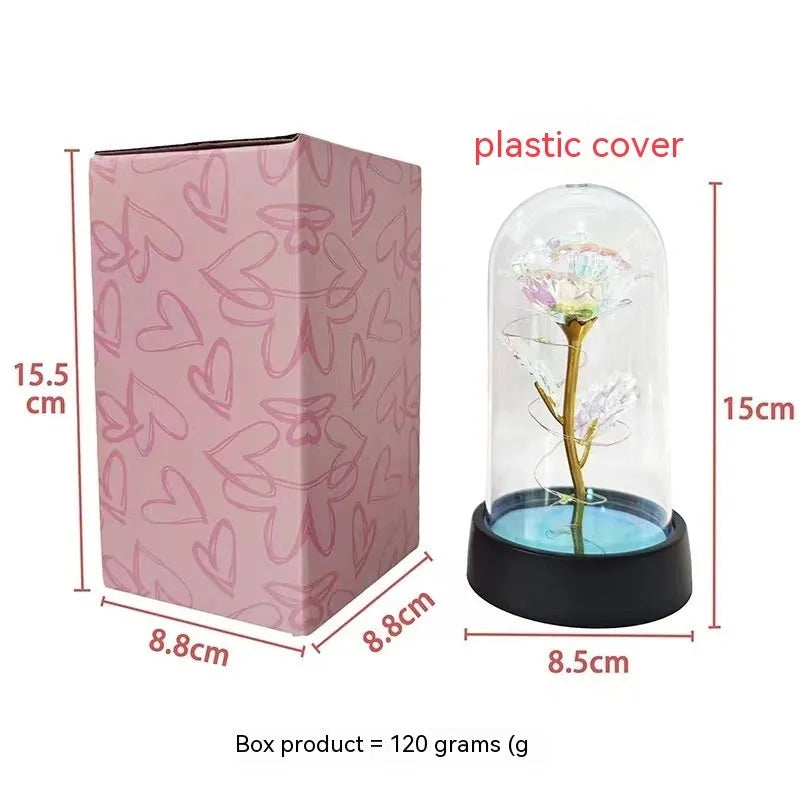 Glass cover small night lamp with plastic flowers in 15cm tall design with black base