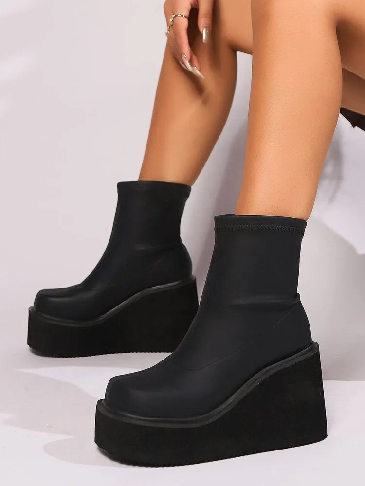 Plus size women's black wedge heel platform boots with round toe and waterproof PU upper