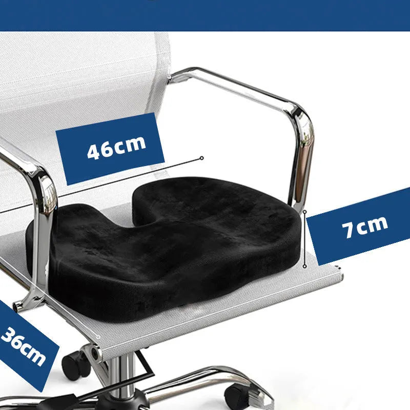 Black U-shaped memory foam seat cushion with removable flannel cover, shown on a office chair.