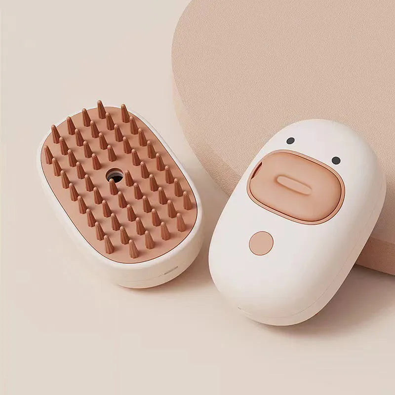White silicone steam brush for pet grooming with rubber teeth and water tank.