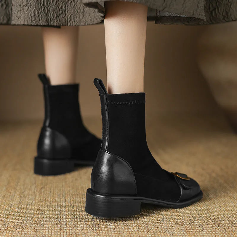 Women's black low heel Martin ankle boots with lace-up front and buckle stitching detail